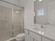 Updated bathroom with a walk-in shower and modern vanity at 1472 Fairview Cir, Reunion, FL 34747