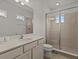 Bathroom with shower, toilet and vanity with a large mirror at 1472 Fairview Cir, Reunion, FL 34747