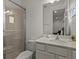 Clean bathroom with a walk-in shower and modern vanity at 1472 Fairview Cir, Reunion, FL 34747