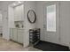 Entryway with built-in shelving, mirror and shoe rack at 1472 Fairview Cir, Reunion, FL 34747