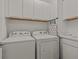 Laundry room with washer, dryer and cabinets at 1472 Fairview Cir, Reunion, FL 34747