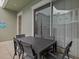 Patio with outdoor dining table at 1472 Fairview Cir, Reunion, FL 34747