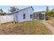 Side view of house, showing pool, fence, and landscaping at 148 Imperial Oak Ct, Davenport, FL 33896