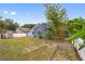 Large backyard with screened pool, landscaping, and shed at 148 Imperial Oak Ct, Davenport, FL 33896