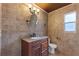 Updated bathroom with granite vanity, tiled walls, and a toilet at 148 Imperial Oak Ct, Davenport, FL 33896