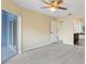 Spacious bedroom with vinyl plank flooring, ceiling fan, and sliding glass doors to patio at 148 Imperial Oak Ct, Davenport, FL 33896