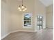 Dining room with vinyl plank flooring and view of the pool through sliding glass doors at 148 Imperial Oak Ct, Davenport, FL 33896