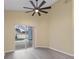 Gathering room with vinyl plank flooring, sliding glass doors, and a view of the pool at 148 Imperial Oak Ct, Davenport, FL 33896