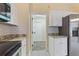 Modern kitchen with white cabinets and granite countertops at 148 Imperial Oak Ct, Davenport, FL 33896