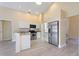 Modern kitchen with granite countertops and stainless steel appliances at 148 Imperial Oak Ct, Davenport, FL 33896