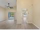 Bright living room with vinyl flooring and view of the pool at 148 Imperial Oak Ct, Davenport, FL 33896