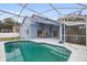 Screened in pool area with patio and backyard view at 148 Imperial Oak Ct, Davenport, FL 33896