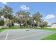 Community basketball court under large oak trees at 1580 Prairie Oaks Dr, St Cloud, FL 34771