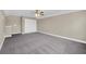 Spacious bedroom with ceiling fan and carpet flooring at 1580 Prairie Oaks Dr, St Cloud, FL 34771