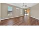 Main bedroom with wood flooring, sliding doors, and pool access at 1580 Prairie Oaks Dr, St Cloud, FL 34771