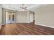 Spacious bedroom with wood-look flooring and sliding glass doors at 1580 Prairie Oaks Dr, St Cloud, FL 34771