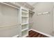 Walk-in closet with shelving and hanging rods at 1580 Prairie Oaks Dr, St Cloud, FL 34771