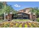 East Lake Park community entrance, featuring a brick wall and lush landscaping at 1580 Prairie Oaks Dr, St Cloud, FL 34771