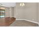 Bright dining area with wood-look flooring and access to the pool at 1580 Prairie Oaks Dr, St Cloud, FL 34771