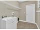 Laundry room with utility sink and shelving at 1580 Prairie Oaks Dr, St Cloud, FL 34771