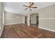 Sunlit living room with hardwood floors and high ceilings at 1580 Prairie Oaks Dr, St Cloud, FL 34771