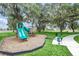 playground with a slide and play structure, shaded by oak trees at 1580 Prairie Oaks Dr, St Cloud, FL 34771