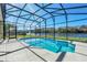 Inviting screened pool with lake view at 1580 Prairie Oaks Dr, St Cloud, FL 34771