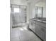 Modern bathroom with granite countertops and a glass shower at 1603 Gardiner St, Haines City, FL 33844