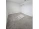 Well-lit bedroom with carpet and double door closet at 1603 Gardiner St, Haines City, FL 33844