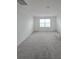 Large bonus room featuring neutral carpeting and window at 1603 Gardiner St, Haines City, FL 33844