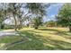 Large backyard with mature trees and plenty of green space at 16036 3Rd St, Umatilla, FL 32784