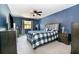 Spacious bedroom with blue walls and a ceiling fan at 16036 3Rd St, Umatilla, FL 32784