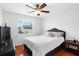 Spacious bedroom with hardwood floors and ceiling fan at 1718 Errol Woods Dr, Apopka, FL 32712