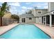 Stunning pool with a large patio and fenced backyard at 1718 Errol Woods Dr, Apopka, FL 32712