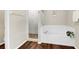 Clean bathroom with tub, shower, and hardwood floors at 1727 Wood Violet Dr, Orlando, FL 32824