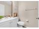 Clean bathroom with white vanity, toilet and mirror at 1727 Wood Violet Dr, Orlando, FL 32824