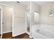 Bathroom featuring a tub, walk-in shower and hardwood floors at 1727 Wood Violet Dr, Orlando, FL 32824
