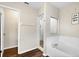 Bathroom with soaking tub and walk-in shower at 1727 Wood Violet Dr, Orlando, FL 32824