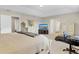 Bright bedroom featuring an adjacent doorway, neutral decor, and contemporary furnishings at 1727 Wood Violet Dr, Orlando, FL 32824