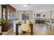 Bright dining room featuring a large wood table, stylish chairs, and a charming display cabinet at 1727 Wood Violet Dr, Orlando, FL 32824