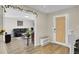 Bright entryway with wood-look floors and a view into the living room at 1727 Wood Violet Dr, Orlando, FL 32824