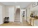 Entryway with staircase, wood floors, and views of a dining room at 1727 Wood Violet Dr, Orlando, FL 32824