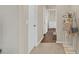 Bright hallway with carpet flooring and storage at 1727 Wood Violet Dr, Orlando, FL 32824