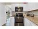 Modern kitchen with stainless steel appliances and granite countertops at 1727 Wood Violet Dr, Orlando, FL 32824