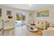 Bright living room with sliding glass doors opening to screened in pool at 1727 Wood Violet Dr, Orlando, FL 32824
