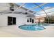 Large kidney shaped pool with screened enclosure at 1727 Wood Violet Dr, Orlando, FL 32824