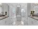 Spa-like bathroom with marble finishes and double vanity at 19115 Palmview St, Orlando, FL 32833