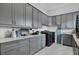 Bright laundry room, featuring ample cabinetry and countertop space at 19115 Palmview St, Orlando, FL 32833