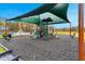 Community playground with shade structure and play equipment at 2480 Penguin Blvd, Davenport, FL 33837