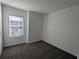 Bright bedroom with grey carpet and window at 2499 Skyline Loop, Kissimmee, FL 34758